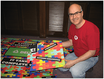 Our owner with one of our early puzzles
