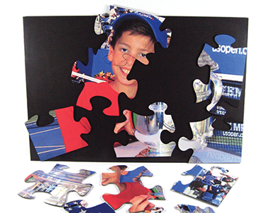 This customized puzzle includes magnets on backs of pieces plus magnetically receptive assembly panel.  available up to 20 x 30 inches.
