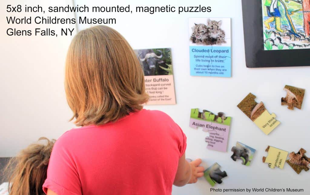 picture of person assembling magnetic museum puzzles